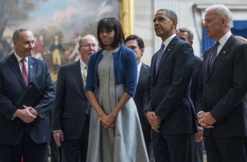 Vizepräsident Joe Biden (rechts), Präsident Barack Obama (zweiter von rechts) und die First Lady Michelle Obama (Mitte)