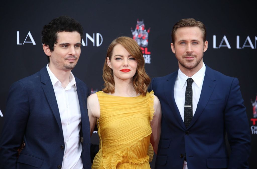 Favoriten für die Oscars: Die Musical-Romanze La-La-Land vom Regisseur Damien Chazelle (links). Die Hauptdarsteller Emma Stone und Ryan Gosling haben bereits Golden Globes bekommen.