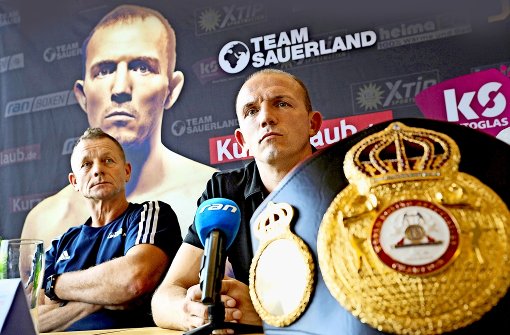 Weltmeister mit Trainer: Jürgen Brähmer (rechts) und Conny Mittermeier Foto: dpa