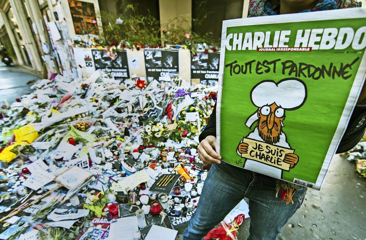 Eine improvisierte Gedenkstätte in Paris nach dem Anschlag auf die Satirezeitung Charlie Hebdo im Januar 2015. Foto: dpa/Ian Langsdon