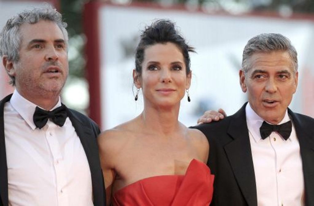 Der Regisseur Alfonso Cuaron mit Sandra Bullock und George Clooney.
