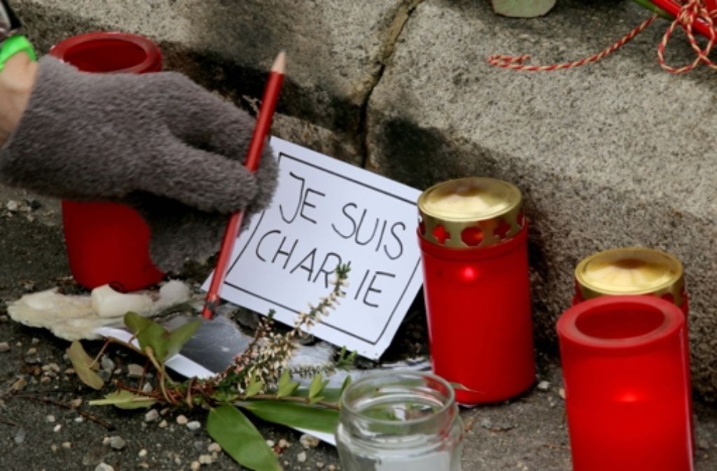 Am Tag danach: Trauer um die Opfer des Terroranschlags von Paris Foto: AP