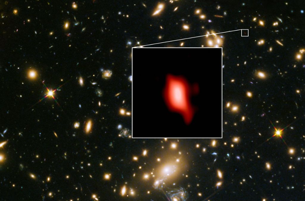 Das vom Hubble-Weltraumteleskop aufgenommene Bild zeigt die Galaxie MACS1149-JD1, die 13,28 Milliarden Lichtjahre von der Erde entfernt ist.