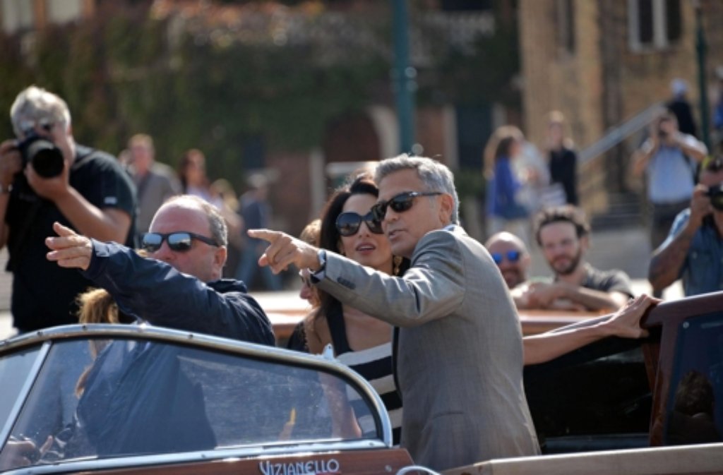Schon bei ihrer Ankuft in Venedig haben George Clooney und seine Zukünftige Amal Alamuddin gehörig für Aufsehen gesorgt.