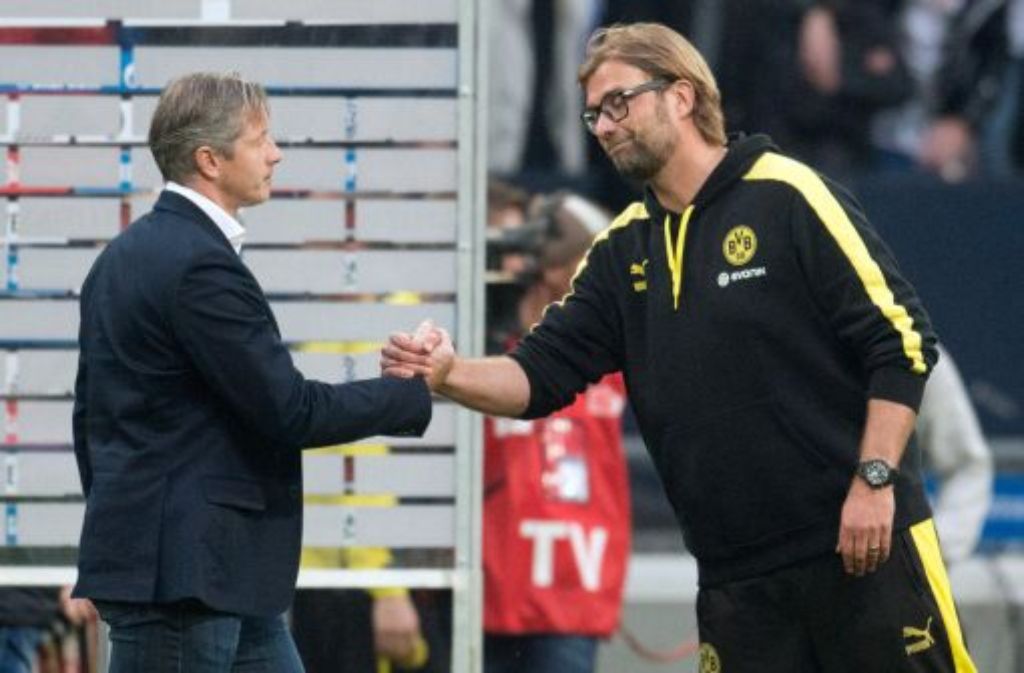 "Es war brutal harte Arbeit für alle." Dortmunds Trainer Jürgen Klopp (rechts, mit Schalke-Trainer Jens Keller) nach dem 3:1-Sieg im Derby auf Schalke.