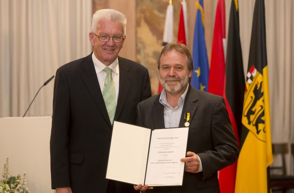 ... 2014 bei der Verleihung des Verdienstordens des Landes durch Ministerpräsident Winfried Kretschmann ...