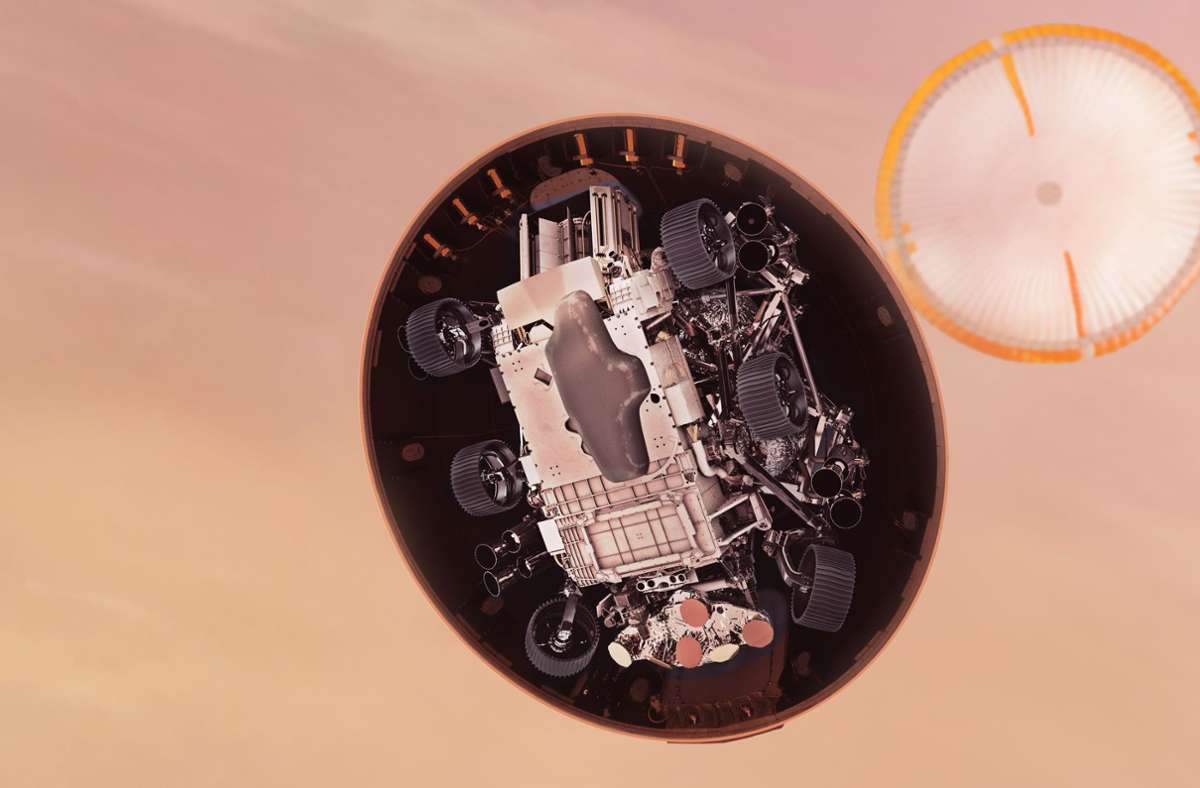 In dieser Illustration wirft der „Perseverance“-Rover der NASA einen ersten Blick auf die Marsoberfläche, nachdem er seinen Hitzeschild knapp sechs Minuten nach Eintritt in die Marsatmosphäre abgeworfen hat.