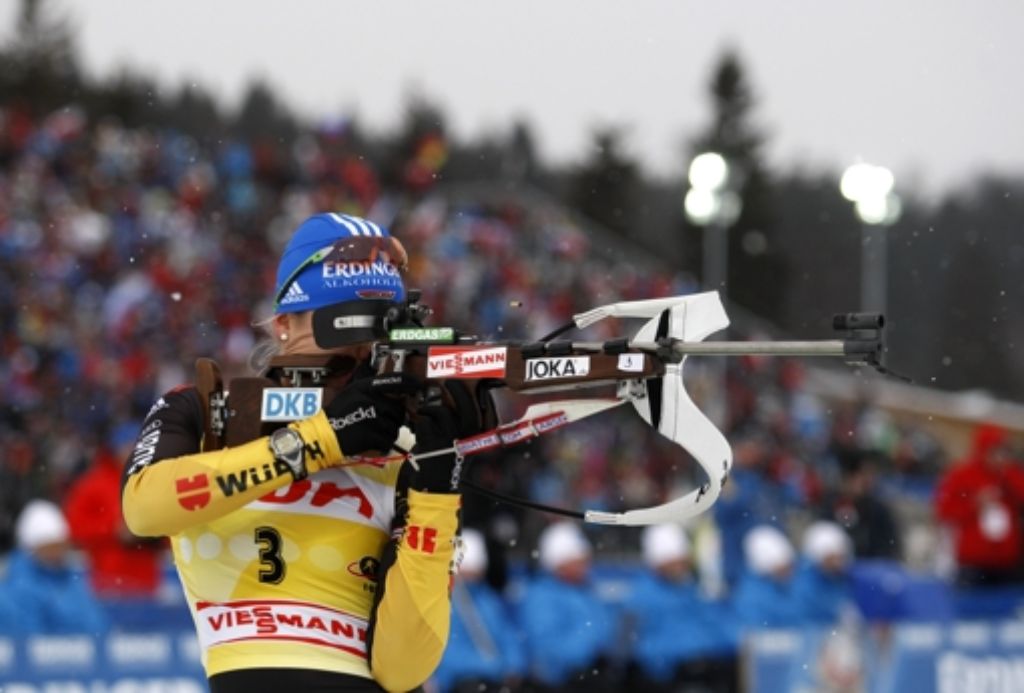 Magdalena Neuner from Germany competes on shooting range to place seventh in the womens 10 km pursuit Biathlon World Cup event in Nove Mesto na Morave, Czech Republic, Sunday, Jan. 15, 2012. (Foto:Petr David Josek/AP/dapd)