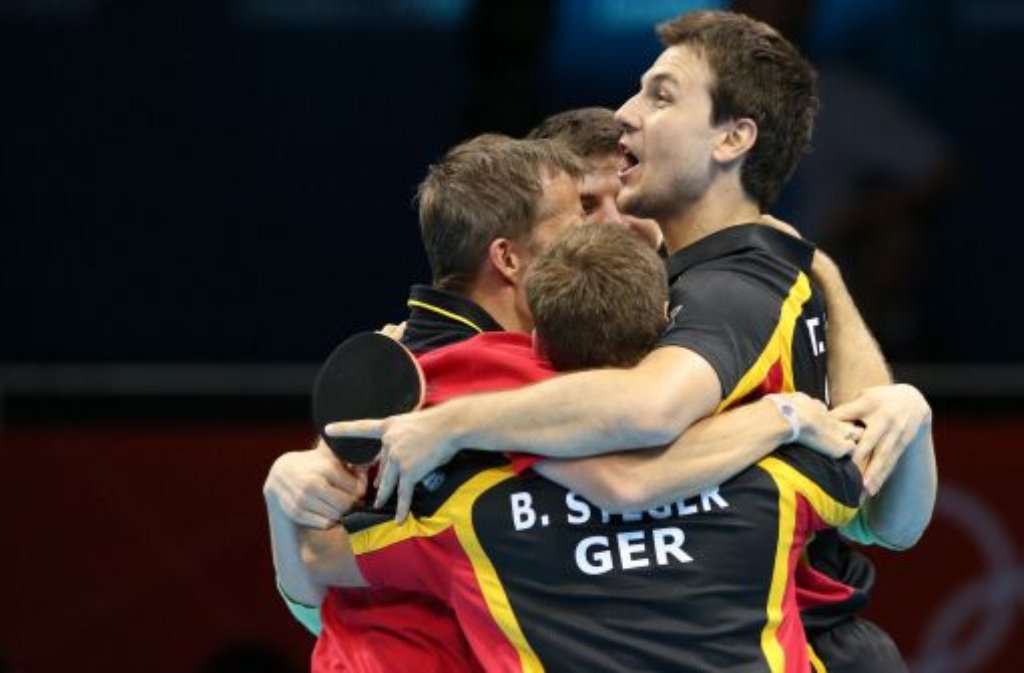 8. August: Deutschlands Tischtennis-Star Timo Boll und seine Kollegen Dimitrij Ovtcharov und Bastian Steger "erschnippelten" sich am Mittwoch gegen die Auswahl aus Hongkong Bronze.
