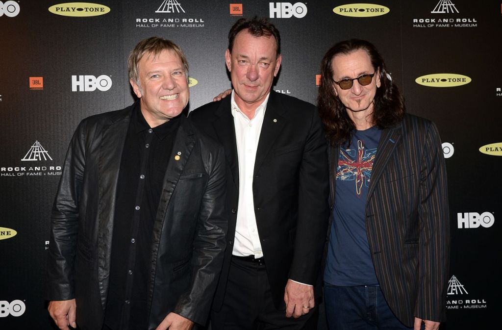 Die Band Rush wurde im Jahr 2013 in die Rock and Roll Hall of Fame aufgenommen: Neil Peart (Mitte) mit Alex Lifeson (links) und Geddy Lee.