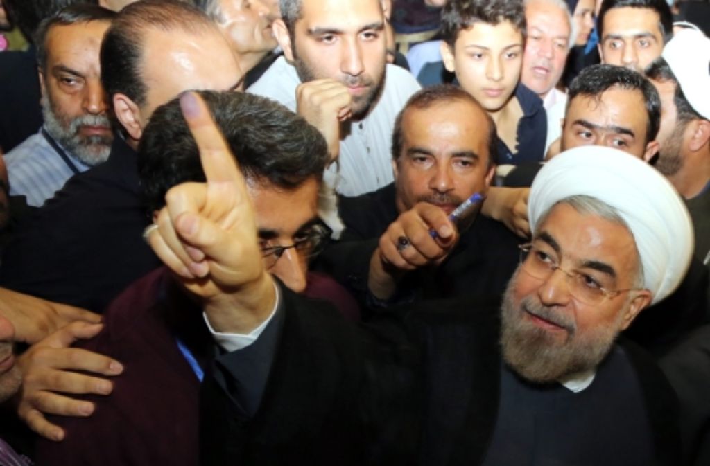 Hassan Ruhani (re.) verspricht Reformen. Foto: EPA