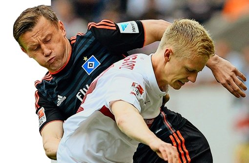 Kampf um den Ball: Timo Baumgartl vom VfB (vorn) und Ivica Olic vom HSV  Foto: dpa