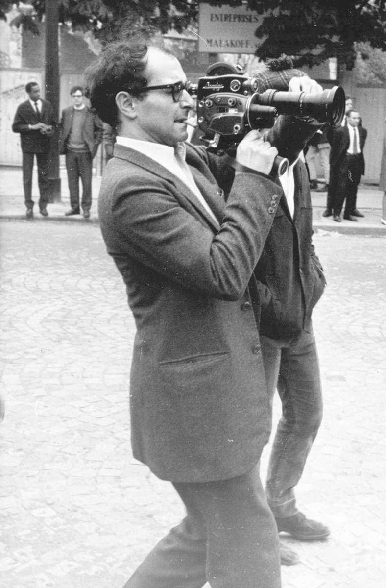 Jean-Luc Godard im Mai 1968 in Paris, die Studentenproteste filmend