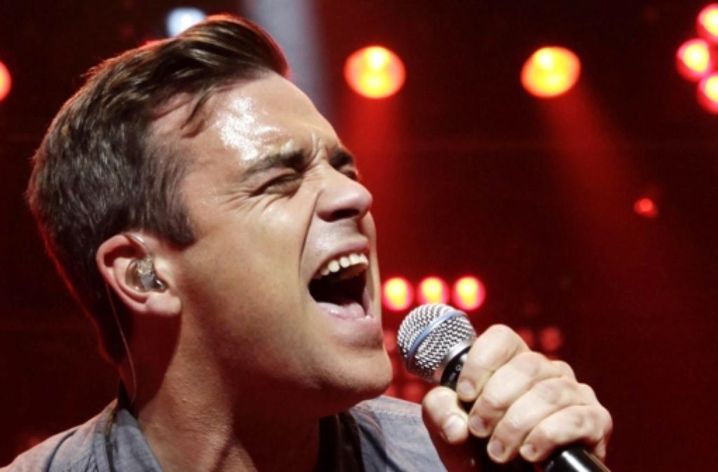 Der Entertainer Robbie Williams hat eine bewegtes Leben. In der Fotostrecke zeigen wir einige Stationen seiner Karriere.