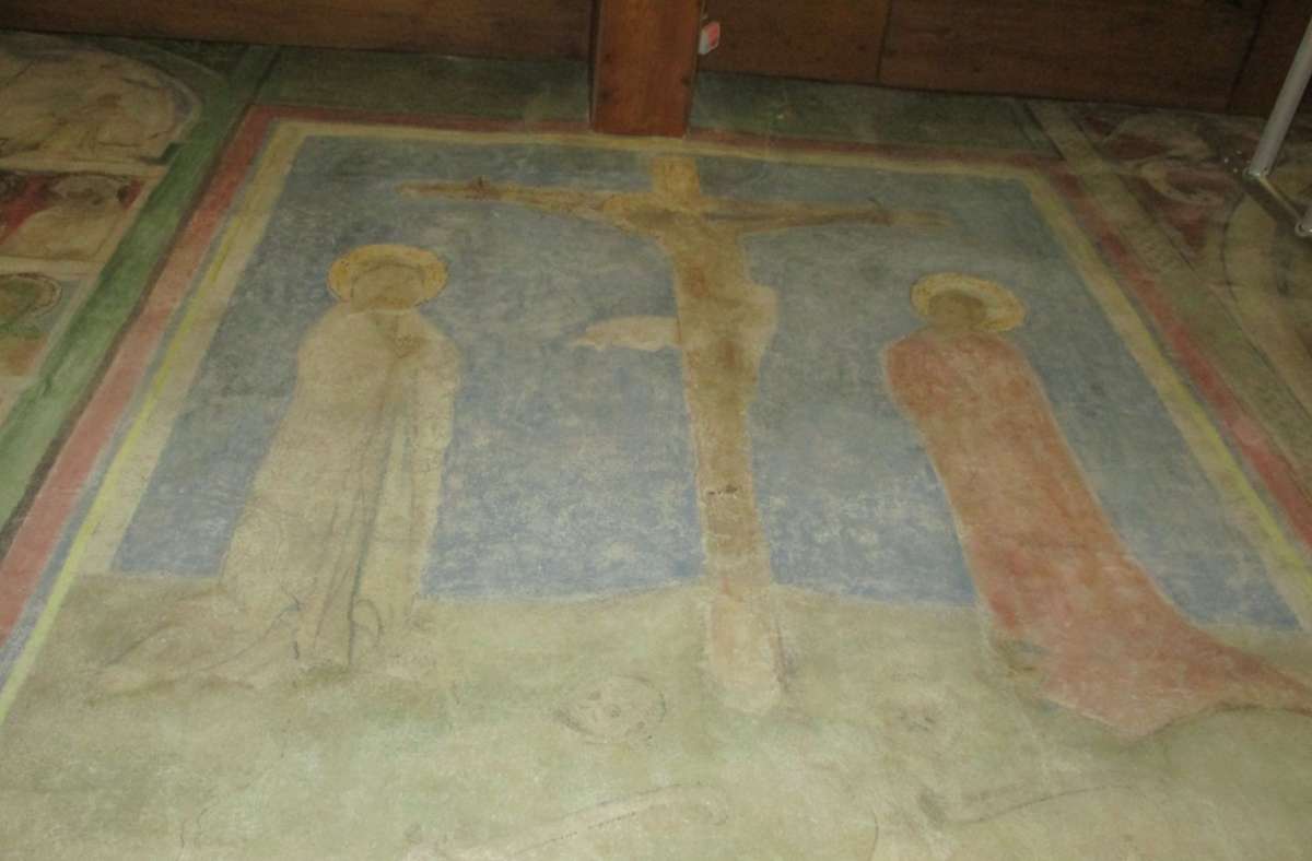 Die Kreuzigung von Jesus Christus auf dem Hügel Golgatha ist das zentrale Motiv in der Mitte der Darstellung.