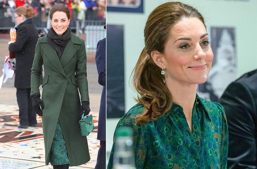 Wegen des schlechten Wetters trug Herzogin Kate über ihrem Pfauen-Kleid einen tannengrünen Mantel.