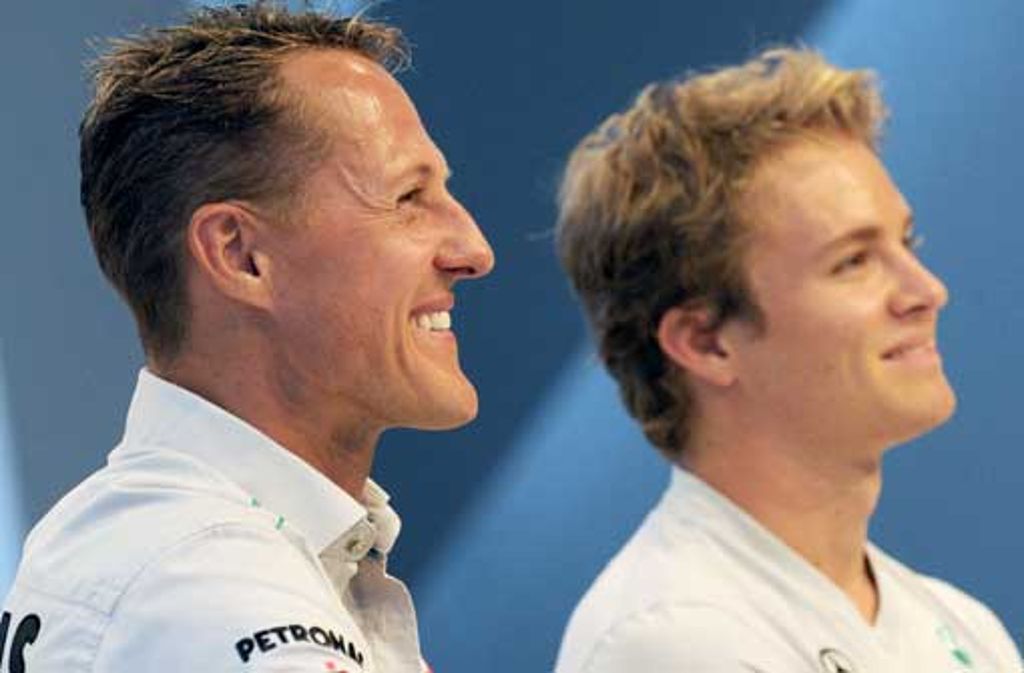 Die deutschen Formel-1-Rennfahrer Michael Schumacher (links) und Nico Rosberg geben Interviews und Autogramme in Stuttgart.