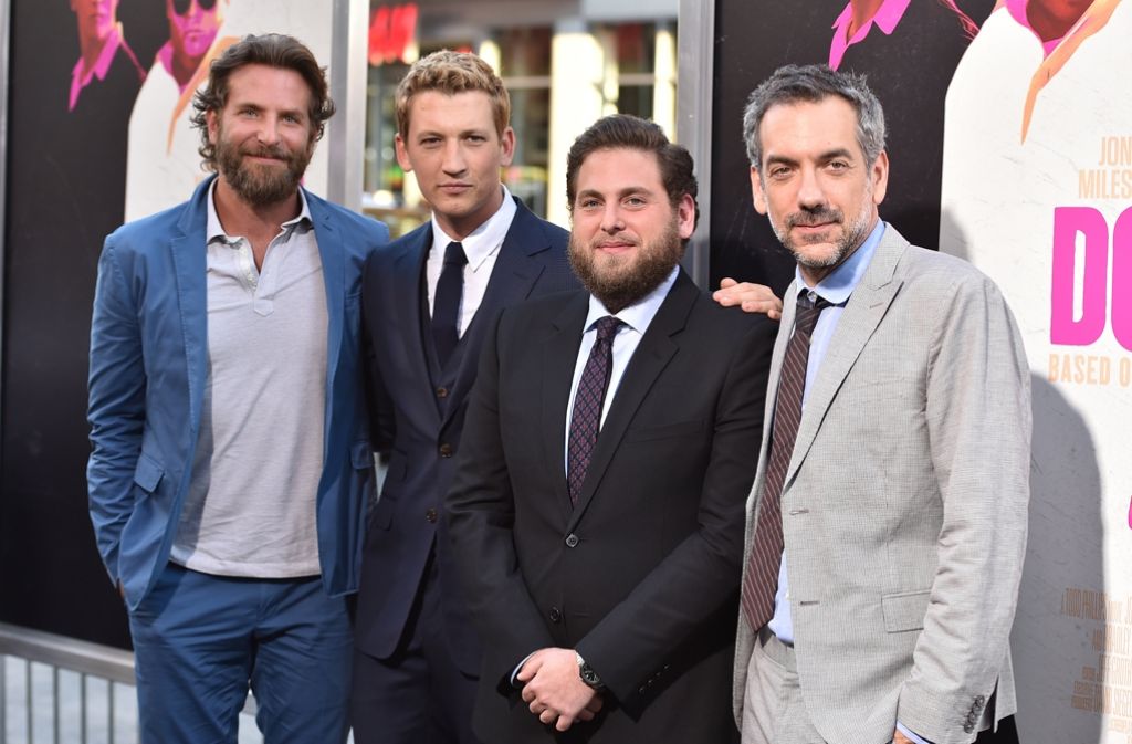 Die Schauspieler Bradley Cooper (v.l.n.r.), Miles Teller und Jonah Hill mit Regisseur Todd Phillips.