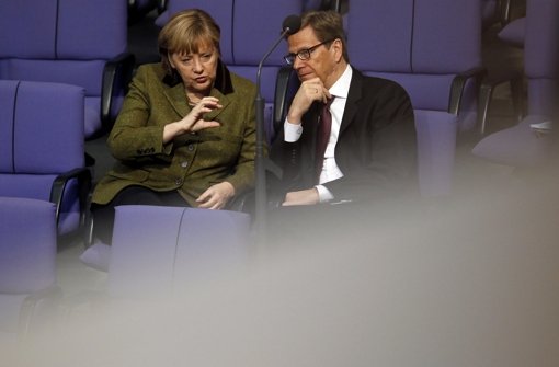 Von 2009 bis 2013 war Westerwelle in einer schwarz-gelben Koalition im Bund unter Merkel Außenminister und zunächst auch Vizekanzler Foto: AP