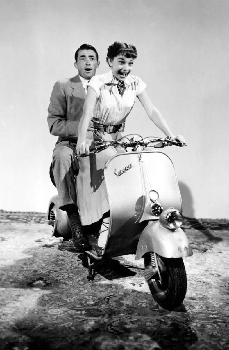 „Ein Herz und eine Krone“ (1953): Joe Bradley (Gregory Peck) und Prinzessin Anne (Audrey Hepburn) fahren auf einer Vespa.