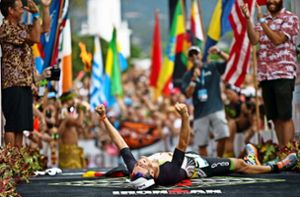Sebastian Kienle im Augenblick des größten Triumphs seines Lebens als Triathlet: der Gewinn der Ironman-WM auf Hawaii. Foto: dpa